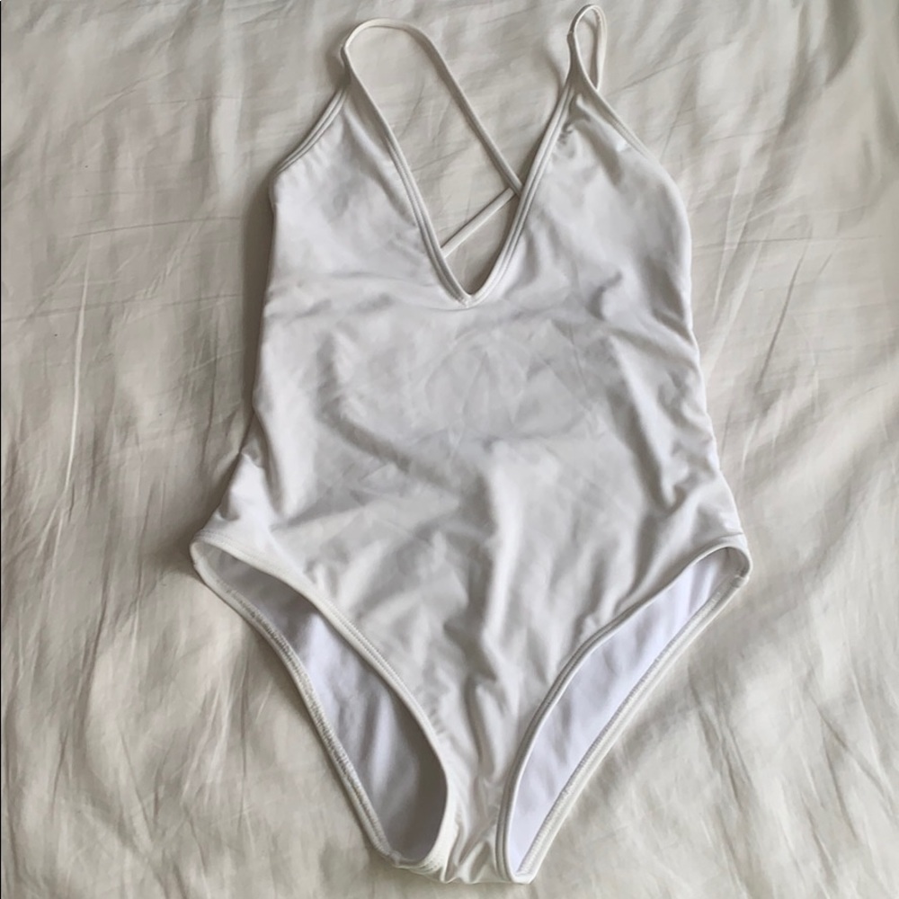 south beach white one piece swimsuit plunge